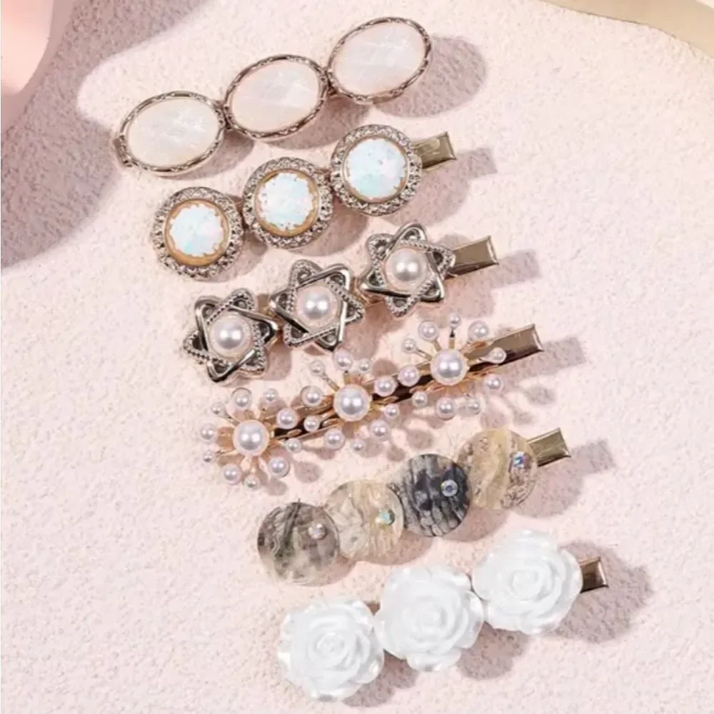 6 piece goldtone pearl shell clip set